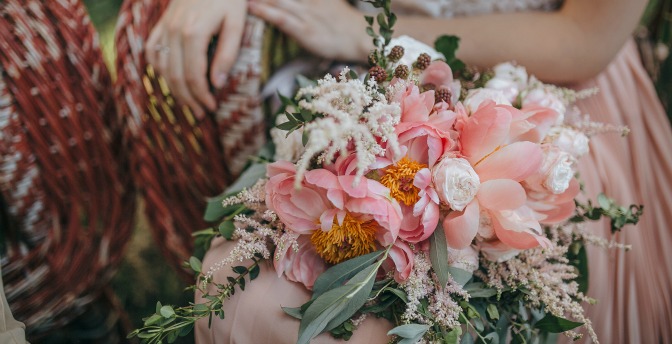 Modern bride with trendy wedding bouquet