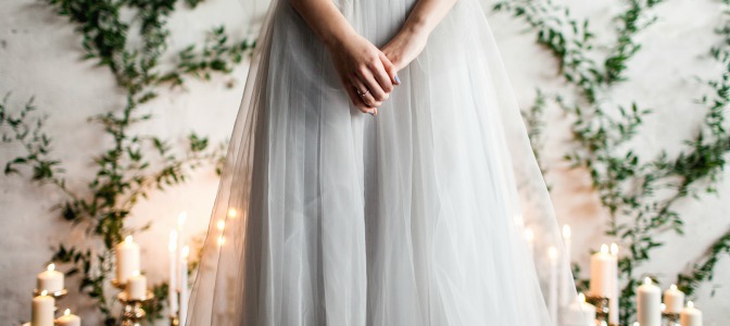 Bride with candlelight aisle and DIY vine background