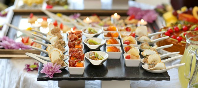 When is the general cut-off time for guest numbers when planning a catered event?