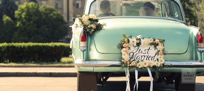 back of a green cadillac with 'just married' sign on back